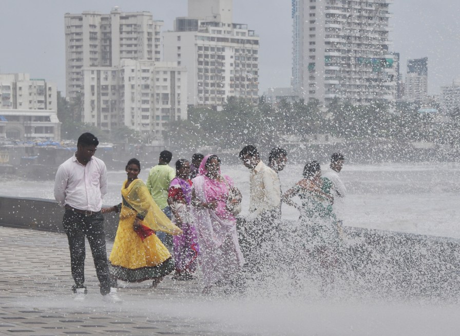 Mumbai, India - 16 June 2015:People enjoying high tide at Worli sea face in Mumbai, India, on Tuesday, June 16, 2015. (Photo by Aloise Tiers/ Hindustan Times)