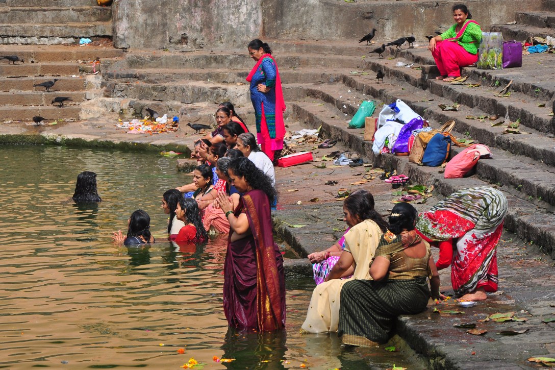 Mumbai, India - 8 July 2015: People taking bath and making blessings in holy water of Banganga Tank at Malabar Hill in Mumbai, India, on Wednesday, July 8, 2015. (Photo by Aloise Tiers/ Hindustan Times)